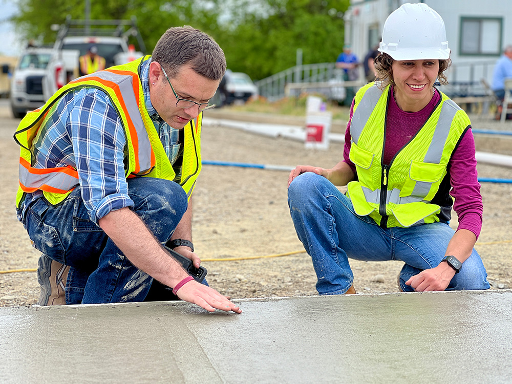 professors studying concrete pour
