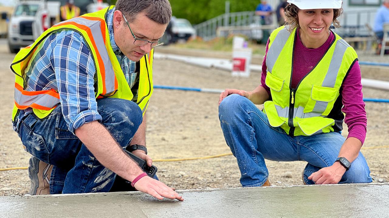 professors studying concrete pour